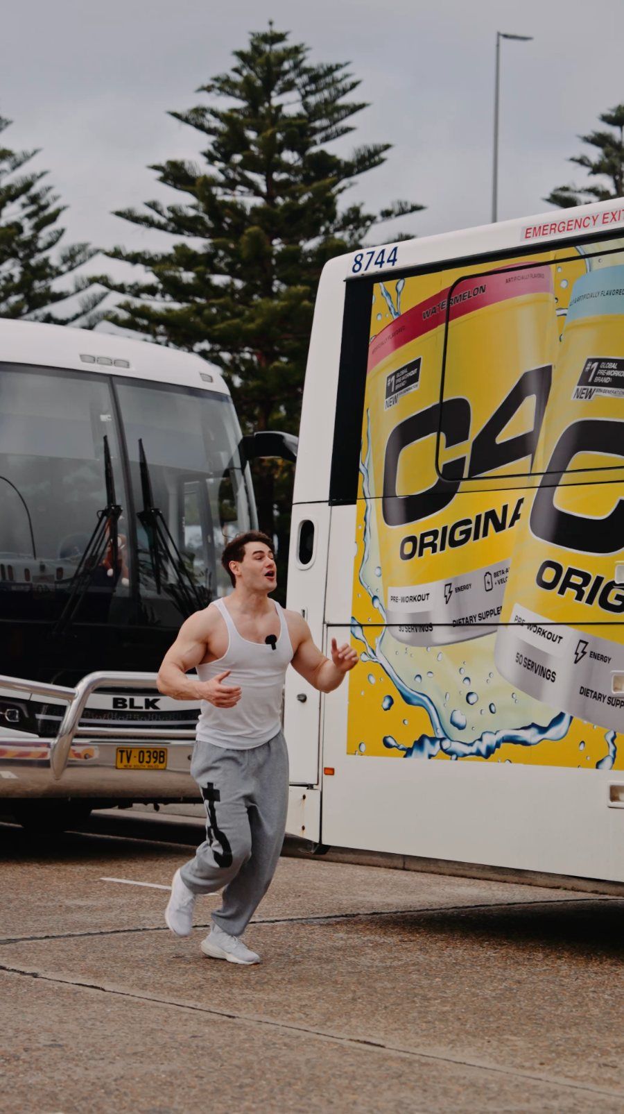 C4 Energy social video: a bodybuilder runs at a C4 bus wrap