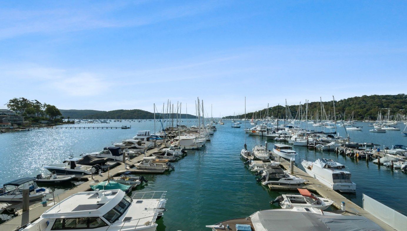The marina outside the Media Monkey office: boats moored along the jetties of a Northern Beaches waterway